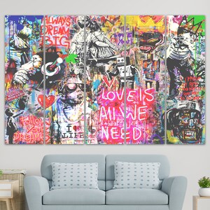 May include: A multi-panel canvas art print with a colourful graffiti style design. The print features bold text, including "Love is All We Need", "Follow Your Dreams", and "Always Dream Big".