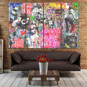 May include: A multi-panel canvas print with a graffiti-style design. The print features a variety of colours, including red, blue, green, yellow, and black. The print also features a variety of text, including "Always Dream Big", "Love is All We Need", and "Follow Your Dreams".