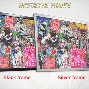 May include: A colourful, abstract art print with a graffiti-style design. The print features a variety of colours, including red, pink, blue, green, and yellow. The print is framed in a black or silver baguette frame. The print includes the text "Always Dream Big" and "Love is All We Need".