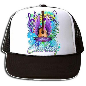 May include: A white and black trucker hat with a colorful design featuring a guitar with wings, musical notes, and the text "I Music Courtney".