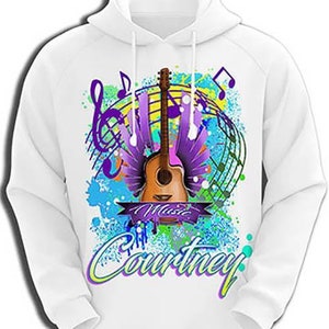 May include: White hoodie with a colorful graphic design featuring a guitar, musical notes, and the word "Music". The name "Courtney" is printed below the design.