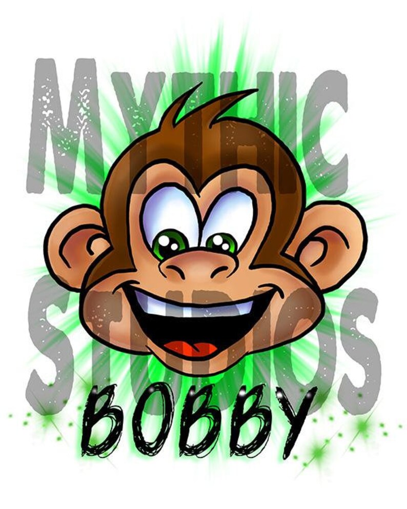 May include: A cartoon monkey with a big smile and green eyes. The monkey is surrounded by a green and white starburst. The text "Mythic Studios Bobby" is written below the monkey.