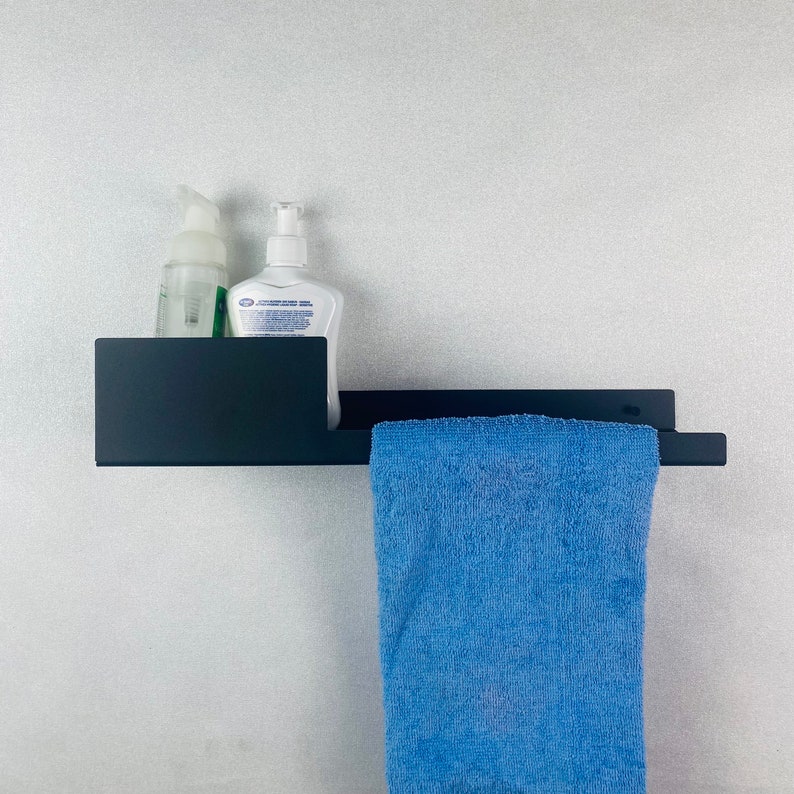 Modern metal bathroom shelf with towel holder
