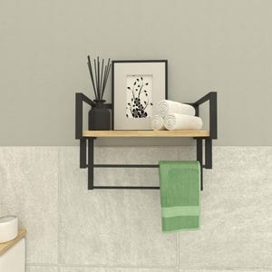 Minimalist floating bathroom shelf with black metal frame and wooden surface, featuring a towel bar for extra functionality