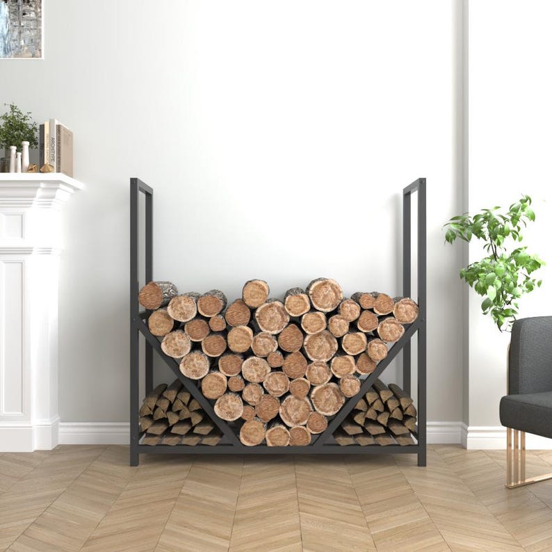 Sturdy black metal firewood organizer with modern design, ideal for neatly storing logs by the fireplace.