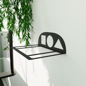 Ping pong paddle and ball holder with Squid Game-inspired symbols, metal wall shelf ideal for table tennis enthusiasts and housewarming gifts