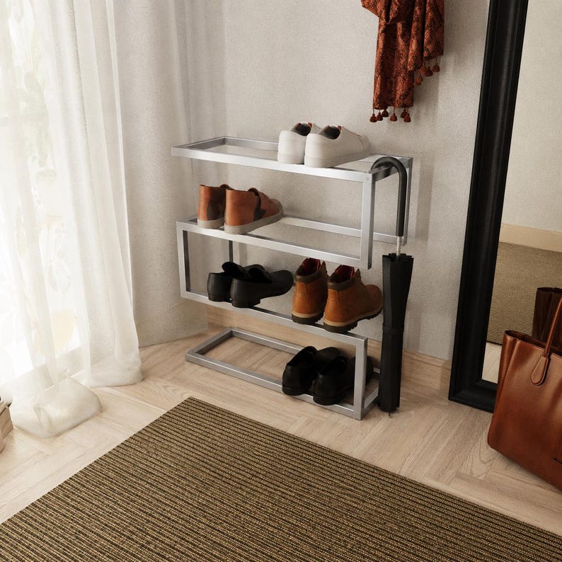 Modern metal freestanding shoe rack with umbrella holder, perfect for entryway or hallway organization.