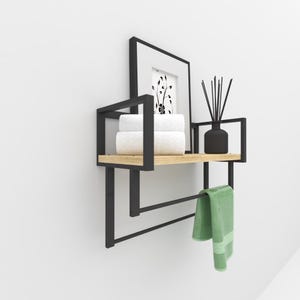 Space-saving floating shelf with towel bar, designed for modern and minimalist bathroom decor.
