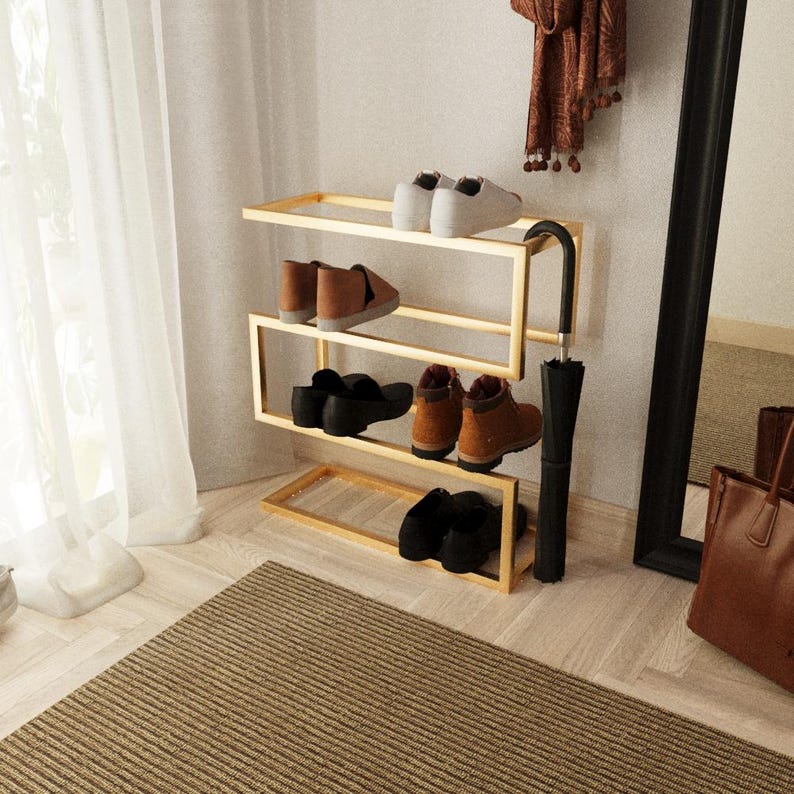 Entryway shoe storage solution with sleek gold metal finish and integrated umbrella stand
