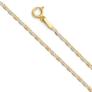 May include: A gold chain necklace with a mariner link design. The chain is made of three different colors of gold: yellow, white, and rose.