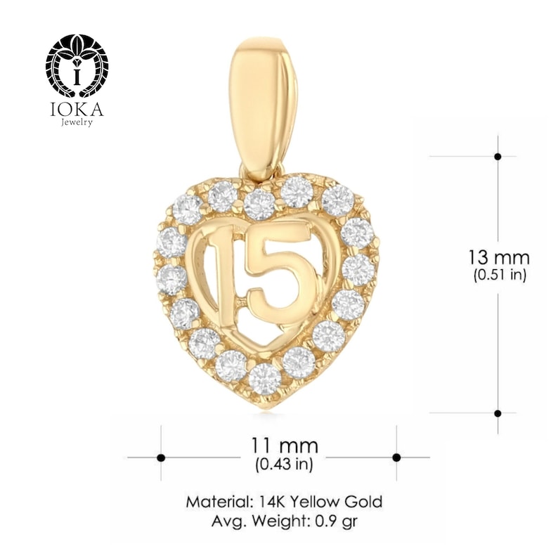 May include: A 14K yellow gold heart pendant with a clear diamond halo and the number 15 in the center. The pendant measures 11 mm by 13 mm.