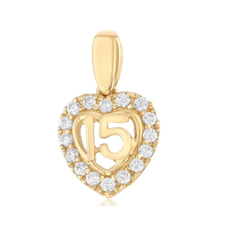 May include: Gold heart-shaped pendant with a clear crystal halo and the number 15 inside.