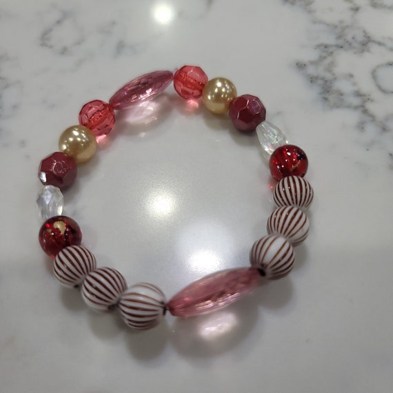 Handmade Stretch band Acrylic Bead Bracelet. Add some zest to your wardrobe with striped beads. Accessorize in style.