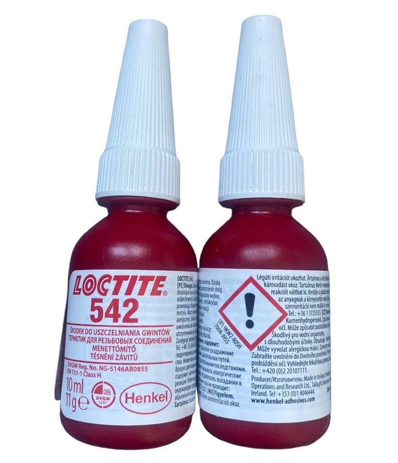 May include: Two 10 ml bottles of red Loctite 542 thread sealant. The bottles have white caps and a warning label with a red exclamation point.