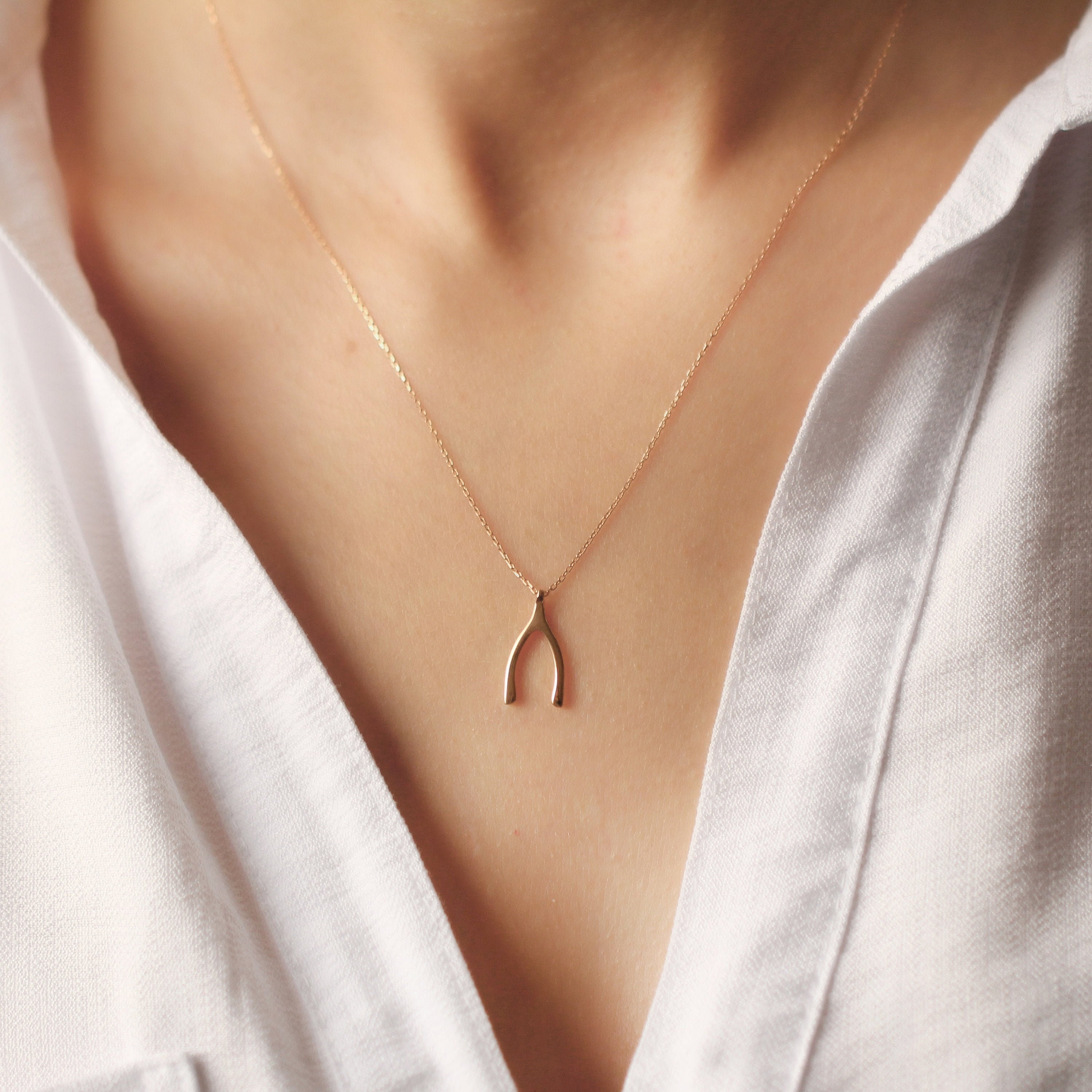 Gold wishbone pendant discount