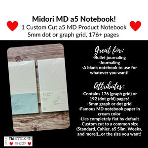 May include: Two Midori MD notebooks in cream-colored paper with protective covers. The packaging features line art of a hand writing. Text includes Midori MD a5 Notebook, 1 Custom Cut a5 MD Product Notebook, 5mm dot or graph grid, 176+ pages.
