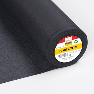 Könnte beinhalten: Eine Rolle schwarzes Vlieseline G 405/319 Einlage-Gewebe. Das Etikett zeigt an, dass es aus 65% PA, 35% R-PES besteht und 90 cm x 25 m misst.