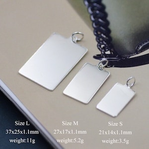 May include: Three silver rectangular tags of different sizes, labelled "Size L", "Size M", and "Size S". Each tag has dimensions and weight listed in millimetres and grams.