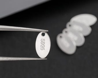 Joyería ovalada de plata esterlina grabada a láser personalizada. Etiquetas: 10 piezas