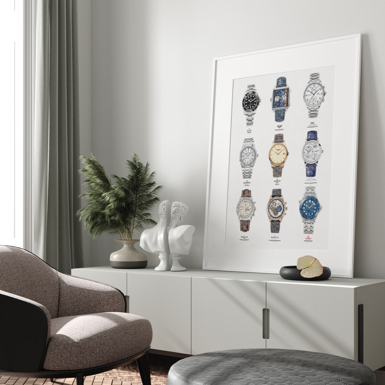 May include: A white framed poster with a collection of 12 different wristwatches. The watches are arranged in four rows of three. Each watch has a different design and color scheme. The poster is hanging on a white wall.