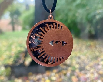 Copper Circle Eye Moon Charm with Black Copper Flakes Resin Pendant on Black Adjustable Genuine Leather Necklace.