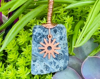 Polished Cambodian Jasper Stone Copper Wire Wrapped Pendant with sun like copper charm on adjustable faux leather Necklace.