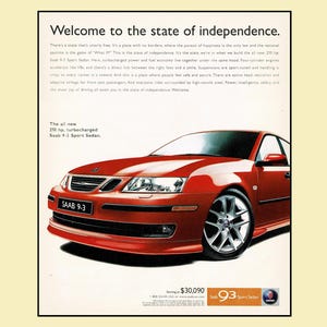 May include: A red Saab 9-3 Sport Sedan featured in a print advertisement with the headline Welcome to the state of independence. The text highlights 210 hp, a turbocharged engine, and safety features. The car has silver alloy wheels and a black grille.