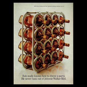 May include: A white metal wine rack filled with bottles of Johnnie Walker Red Label Scotch Whisky. The rack is on a white surface. The text "Bob really knows how to throw a party. He never runs out of Johnnie Walker Red." is below the rack.