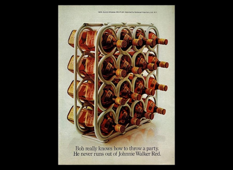 May include: A white metal wine rack filled with bottles of Johnnie Walker Red Label Scotch Whisky. The rack is on a white surface. The text "Bob really knows how to throw a party. He never runs out of Johnnie Walker Red." is below the rack.
