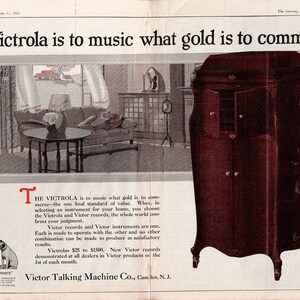 Vintage 1921 Victrola Victor Talking Machine double‑page advertisement featuring a living‑room scene with a Victrola phonograph, a detailed cabinet illustration, and the His Master’s Voice logo. Includes the headline “The Victrola is to music what gold is to commerce.” Large 12×17.5 centerfold with center crease and staple marks, in good vintage condition.