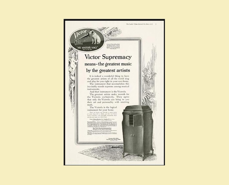 Vintage 1917 Victor Talking Machine advertisement featuring the headline “Victor Supremacy,” the His Master’s Voice logo, decorative side borders, and a photograph of the Victrola XVII model. Promotes the Victrola as the supreme musical instrument for the home. Original 10×16 magazine page in good vintage condition with beige paper and black print.