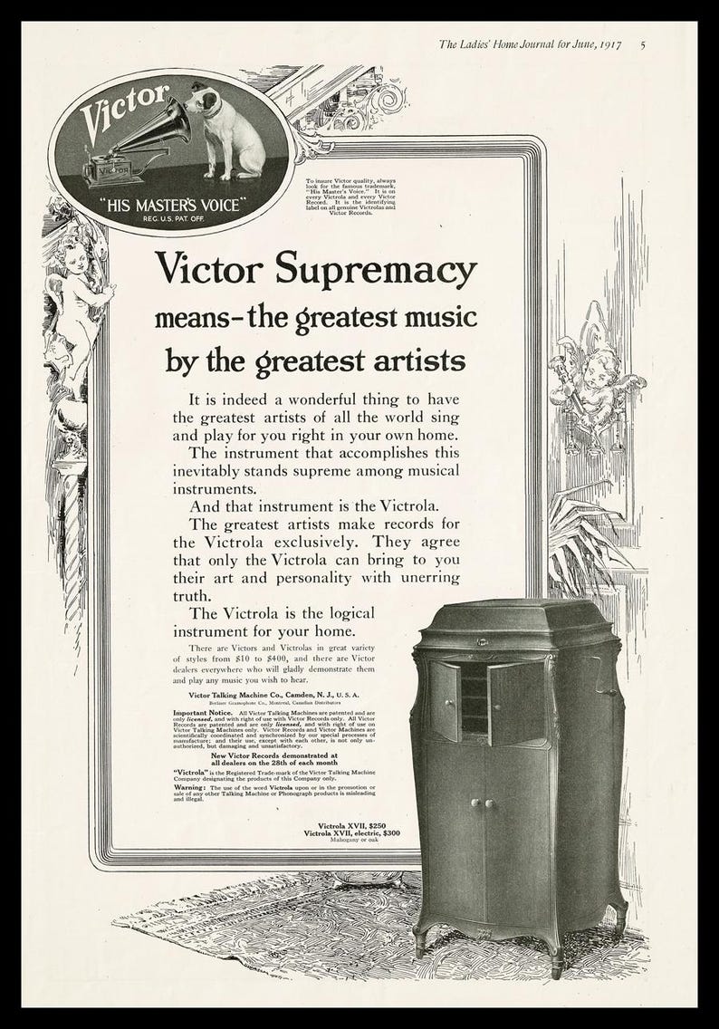 Vintage 1917 Victor Talking Machine advertisement featuring the headline “Victor Supremacy,” the His Master’s Voice logo, decorative side borders, and a photograph of the Victrola XVII model. Promotes the Victrola as the supreme musical instrument for the home. Original 10×16 magazine page in good vintage condition with beige paper and black print.