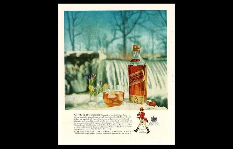 May include: A vintage advertisement for Johnnie Walker Red Label Scotch Whisky. The image features a bottle of whisky, a glass with ice, and a small bouquet of yellow and purple flowers. The background is a snowy winter scene with a waterfall and trees.