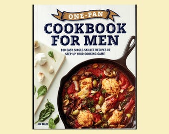 May include: A cookbook titled One-Pan Cookbook for Men with the subtitle 100 Easy Single-Skillet Recipes to Step Up Your Cooking Game. The cover features a cast iron skillet filled with a cooked dish of tomatoes, greens, and chicken pieces.