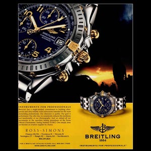 May include: An advertisement featuring two Breitling chronometer watches. The watches have a dark blue face with gold accents and a silver band. The text "Breitling" and "Instruments for Professionals" are visible.