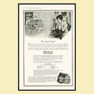 May include: A vintage black and white print advertisement for Crisco featuring illustrations of a man and a woman using telephones. The text includes the headline Yes, Send Crisco, descriptive paragraphs, an Oyster Shortcake recipe, and a book offer.