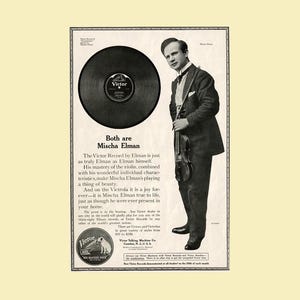 May include: Vintage advertisement featuring Mischa Elman with a violin and a large vinyl record. The ad includes text promoting Victor records and Victrolas, with prices ranging from $10 to $250. The image is in black and white.