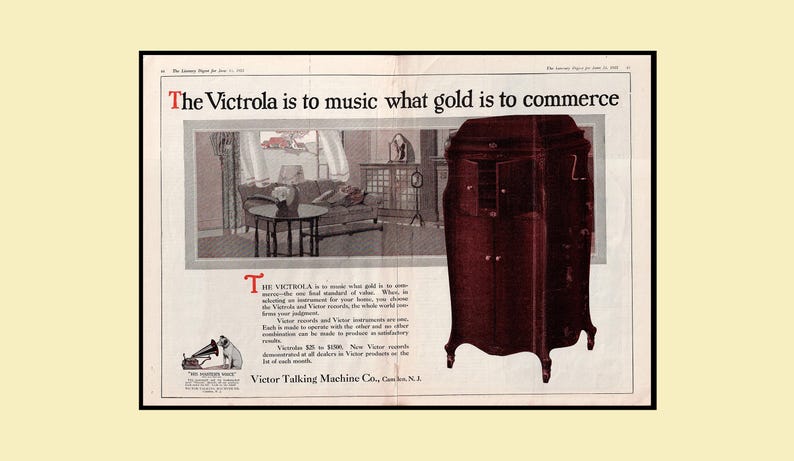 Vintage 1921 Victrola Victor Talking Machine double‑page advertisement featuring a living‑room scene with a Victrola phonograph, a detailed cabinet illustration, and the His Master’s Voice logo. Includes the headline “The Victrola is to music what gold is to commerce.” Large 12×17.5 centerfold with center crease and staple marks, in good vintage condition.
