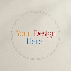 May include: A beige background with a circle in the centre. The circle has a dashed line border and the text "Your Design Here" in orange, red, and blue.
