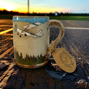 Handmade Cessna 172 over the Evergreens Pottery Mug