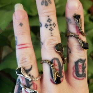Double cones with green tourmaline gemstones.
