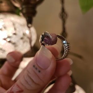 Natural ruby slice in Thai silver claw setting. Adjustable.