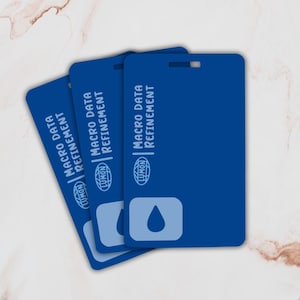 May include: Three blue plastic cards with the text "Macro Data Refinement" and a blue water drop logo. The cards have a hole in the top corner for hanging.
