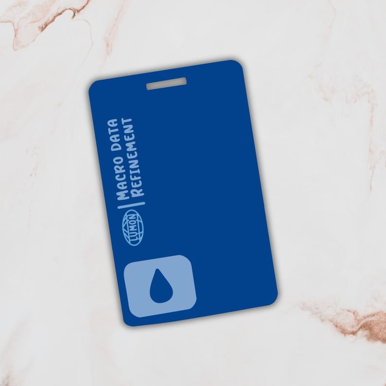 May include: A blue plastic card with the text "MACRO DATA REFINEMENT" and a blue water drop icon. The card has a hole in the top corner.