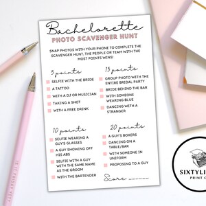 May include: A pink and white printable bachelorette party photo scavenger hunt game card with a list of photo challenges and points awarded for each. The card has the text "Bachelorette Photo Scavenger Hunt" at the top and "Score" at the bottom.