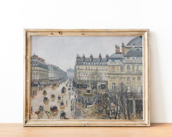 May include: A framed painting depicting a Parisian street scene with buildings, a fountain, and horse-drawn carriages. The painting is done in a muted palette of grays, browns, and blues, giving it a vintage feel.