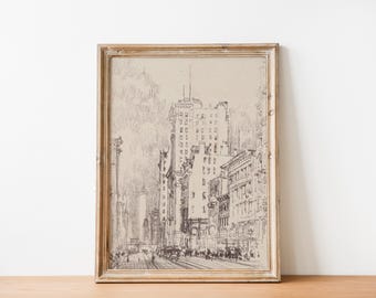 May include: A black and white line drawing of a city street scene with tall buildings, framed in a light brown wood frame.