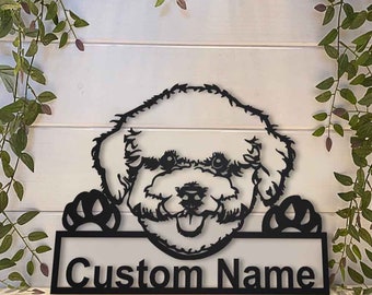 May include: Black metal silhouette of a Bichon Frise dog peeking over a sign with the text "Custom Name".