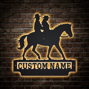 Benutzerdefinierte Cowboy und Cowgirl ein Pferd reiten Metallschild mit LED-Leuchten, personalisierte ein Pferd reiten Metallschild, ein Pferd reiten Wanddekor