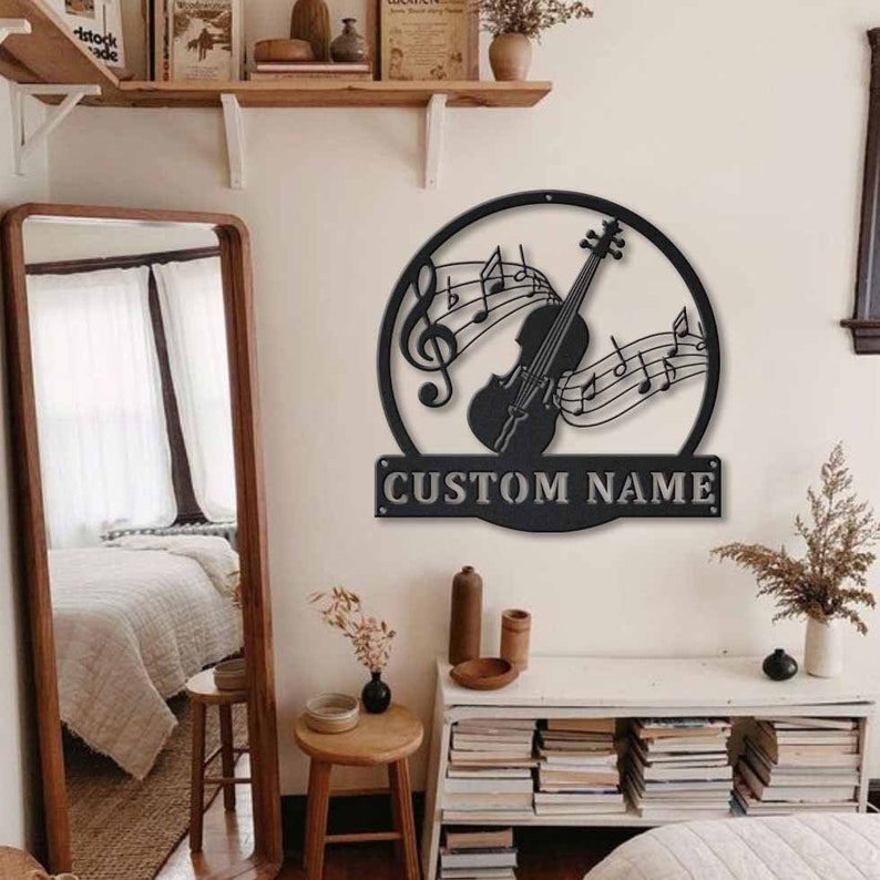 May include: Black metal wall art featuring a violin with musical notes and the text "CUSTOM NAME".